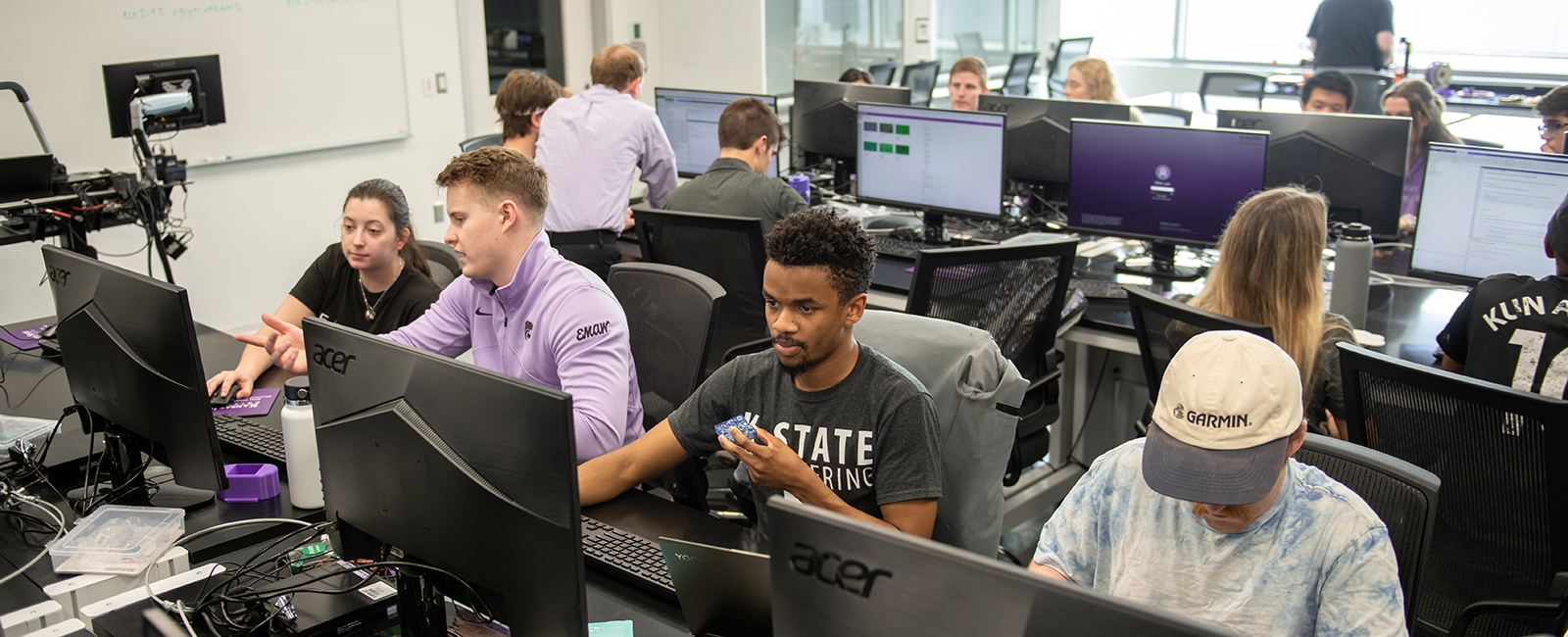 Student working at computers in a classroom